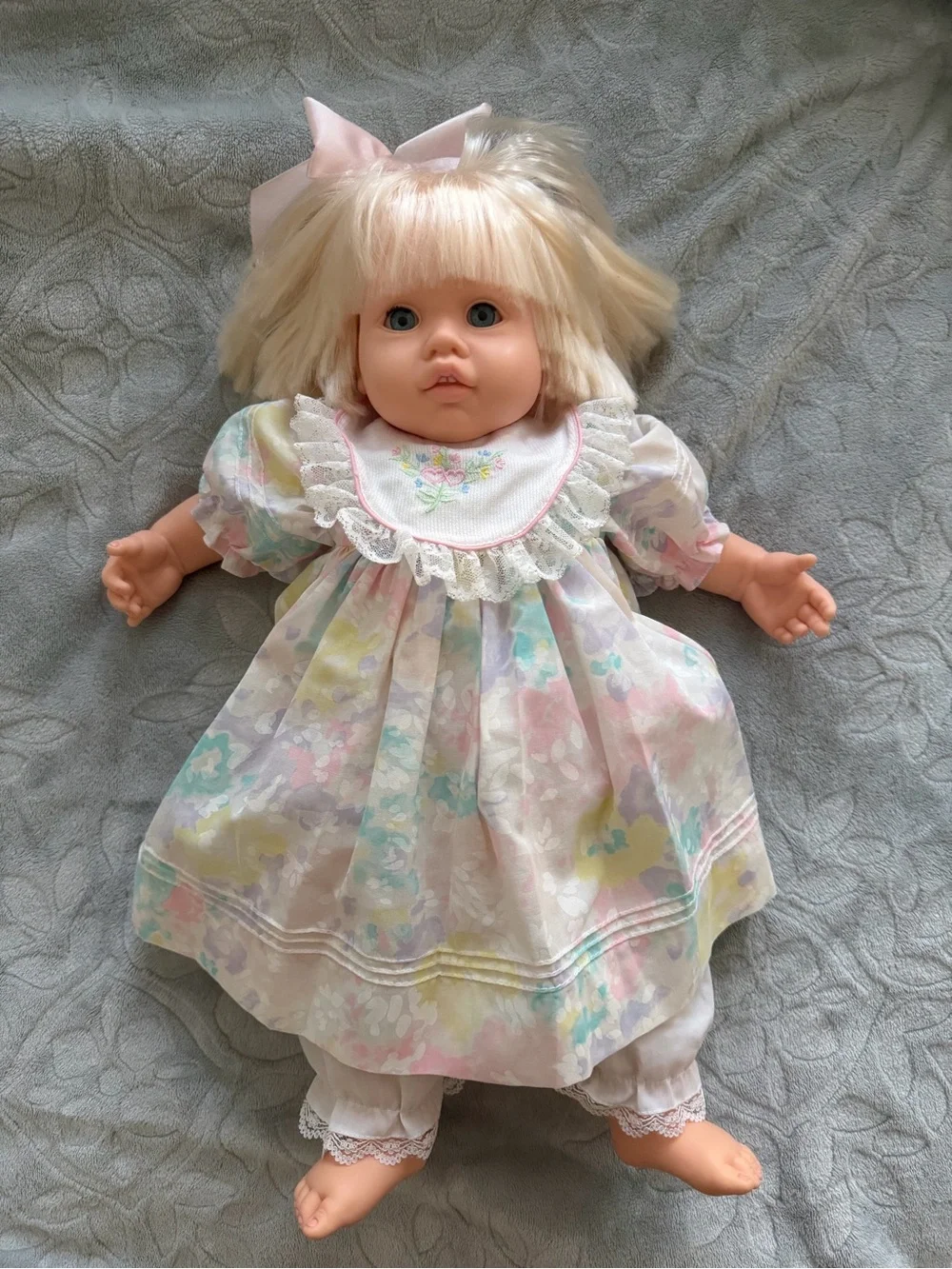 Doll by Pauline Blonde Vinyl Baby Doll with Embroidered Bib